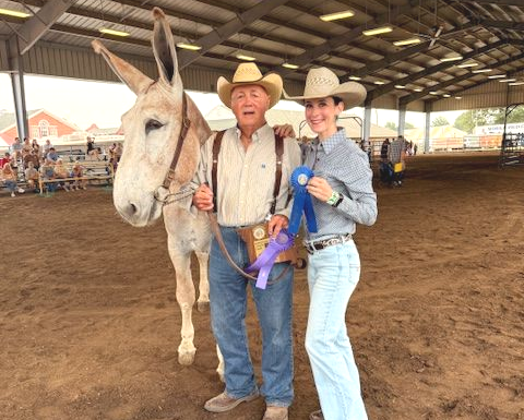 Bill and Becca Garrett with a champion donkey