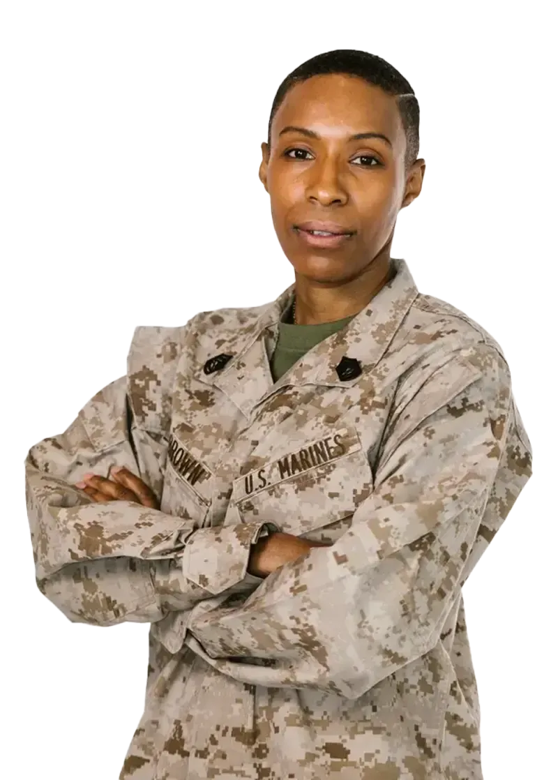 A woman in a military uniform with her arms crossed