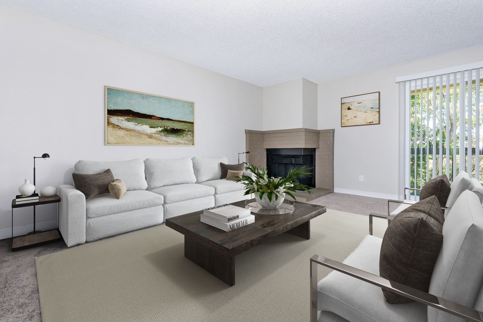 Living room with couch, coffee table, fireplace, and sliding door.