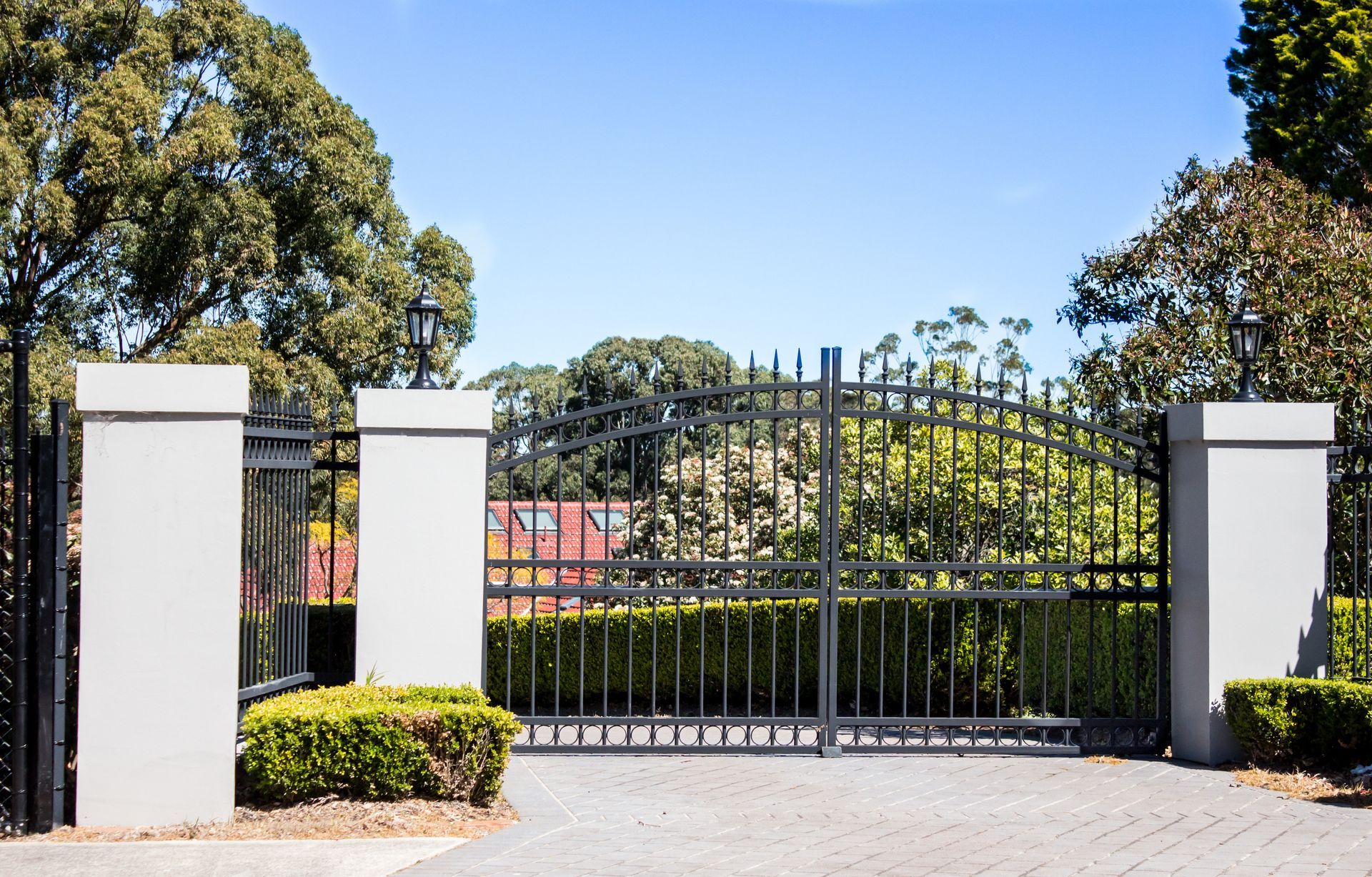 Wooden double doors with metal hinges and latch.