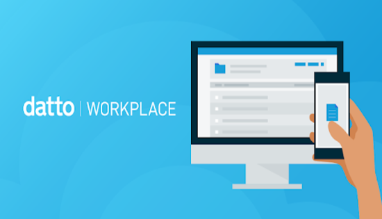 a person is holding a cell phone in front of a computer screen Datto workplace logo.