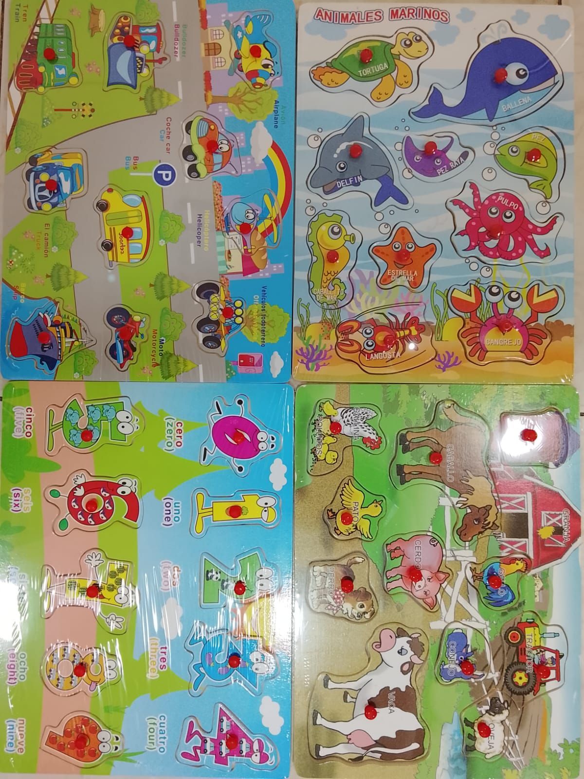 Cuatro rompecabezas de madera con clavijas que representan medios de transporte, criaturas marinas