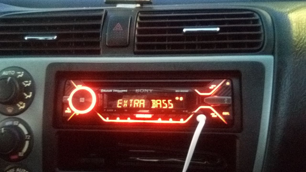 A car radio that says extra bass on it