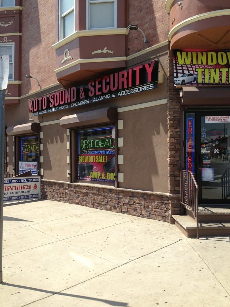 A building with a sign that says auto sound & security
