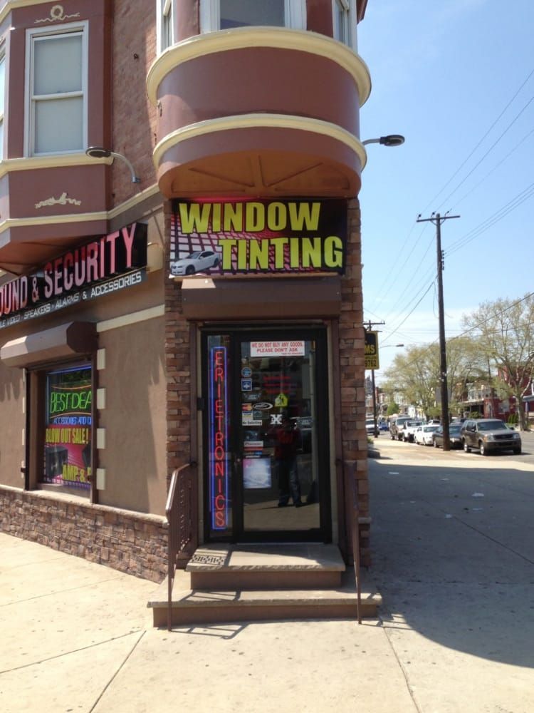 A building with a sign that says window tinting