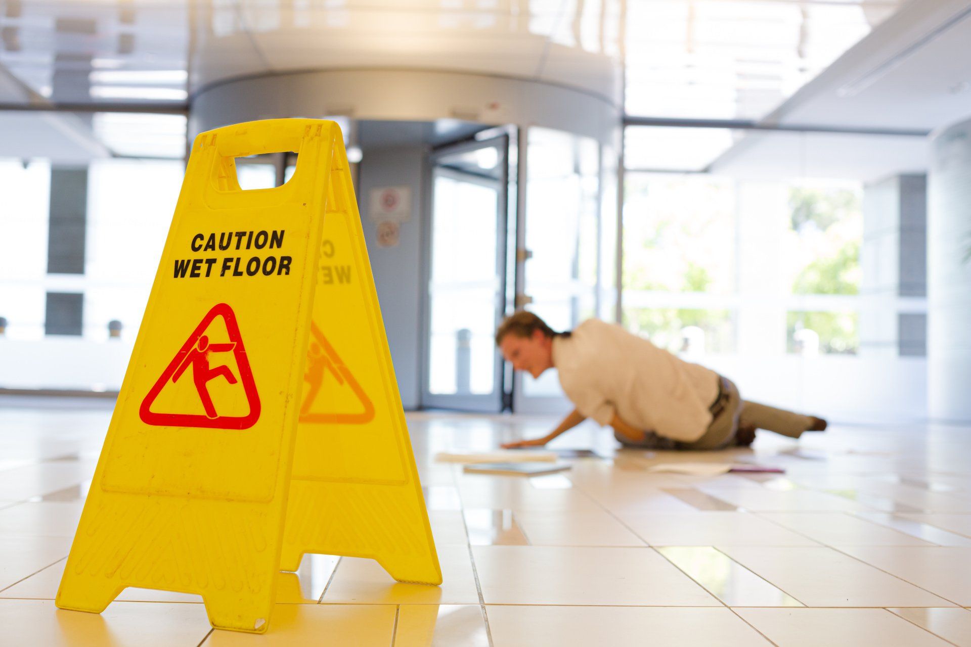 person slipping on a wet floor