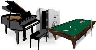 Pianos, safe, and pool table signifying Jones Helps U Move's expertise in moving these items. 