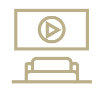 A couch is sitting in front of a television with a play button on it.