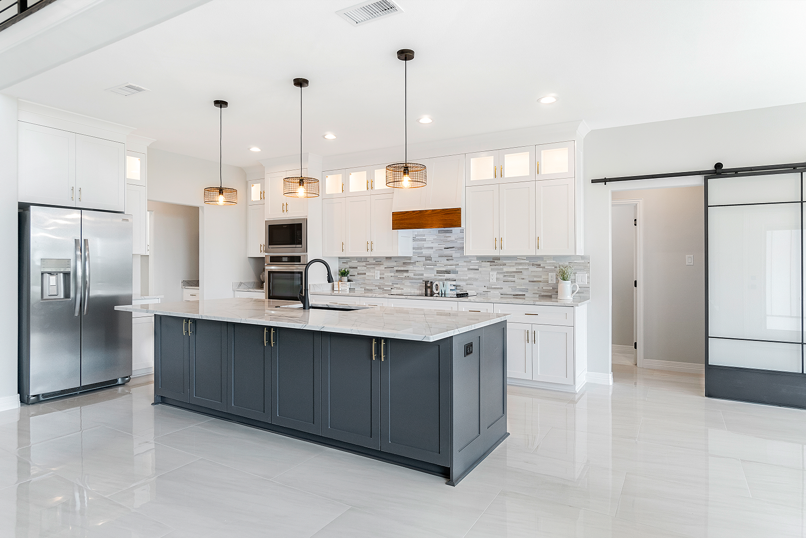 There is a large island in the middle of the kitchen.