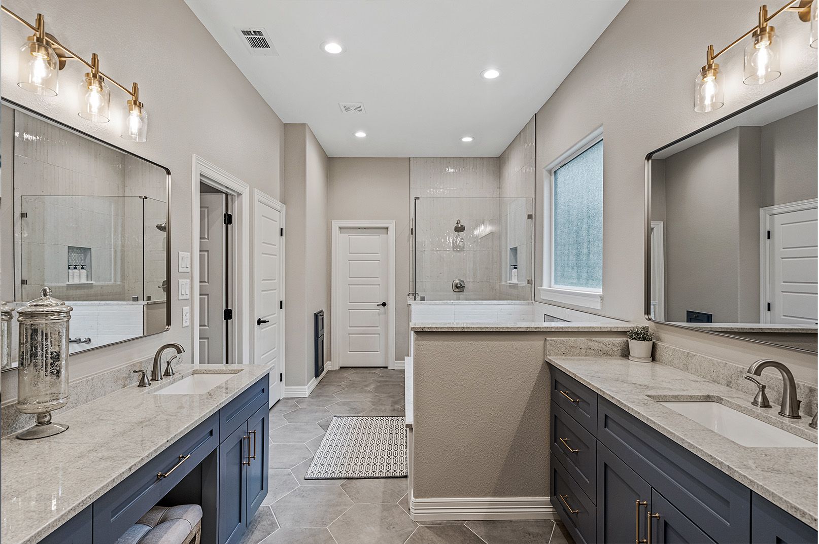 A bathroom with two sinks and two mirrors.