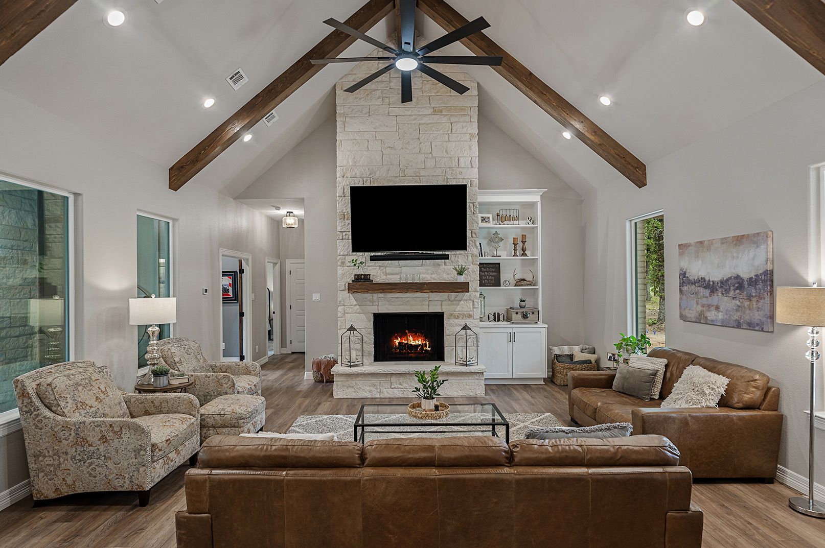 A living room filled with furniture and a fireplace.