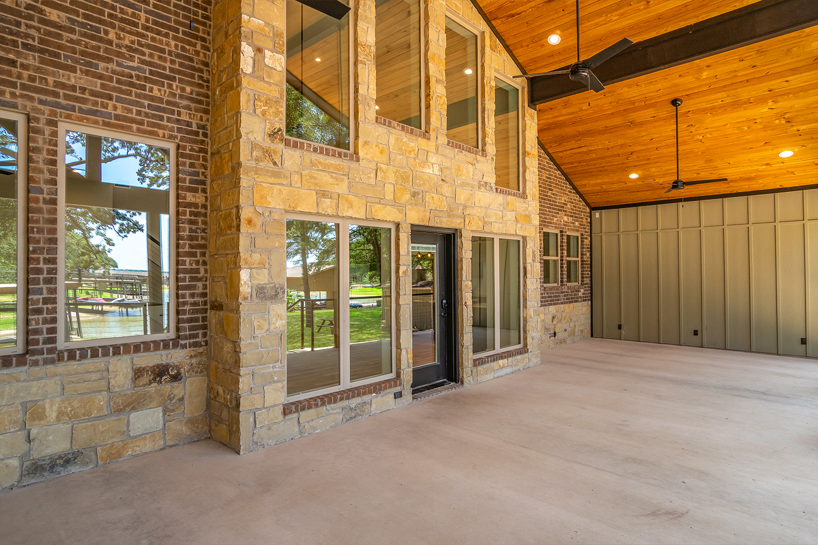 A large brick building with a lot of windows and a wooden ceiling.