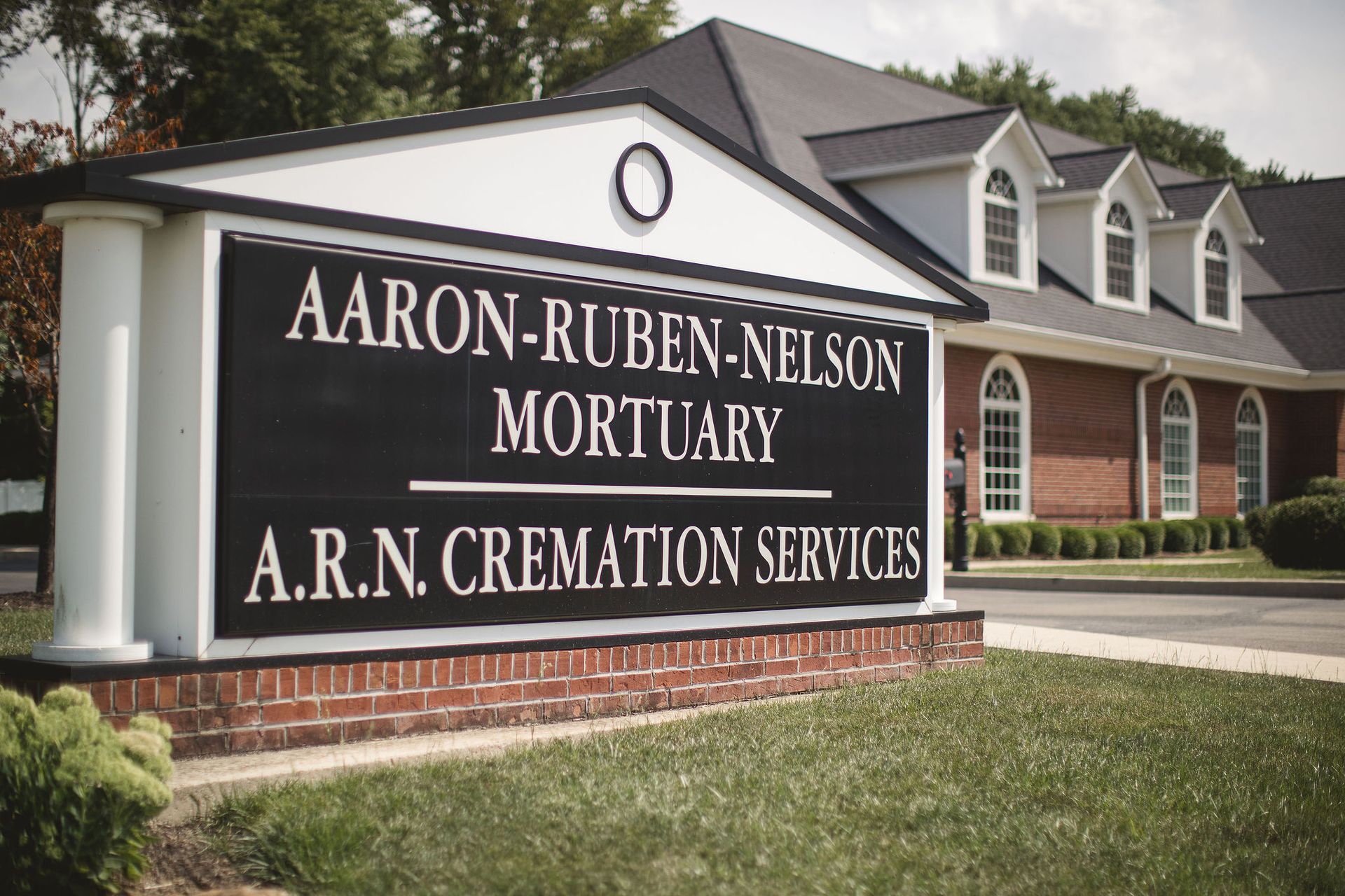 Several photos of interior and exterior views of A.R.N Funeral & Cremation Services, Aaron-Ruben-Nelson Mortuary in Indiana.
