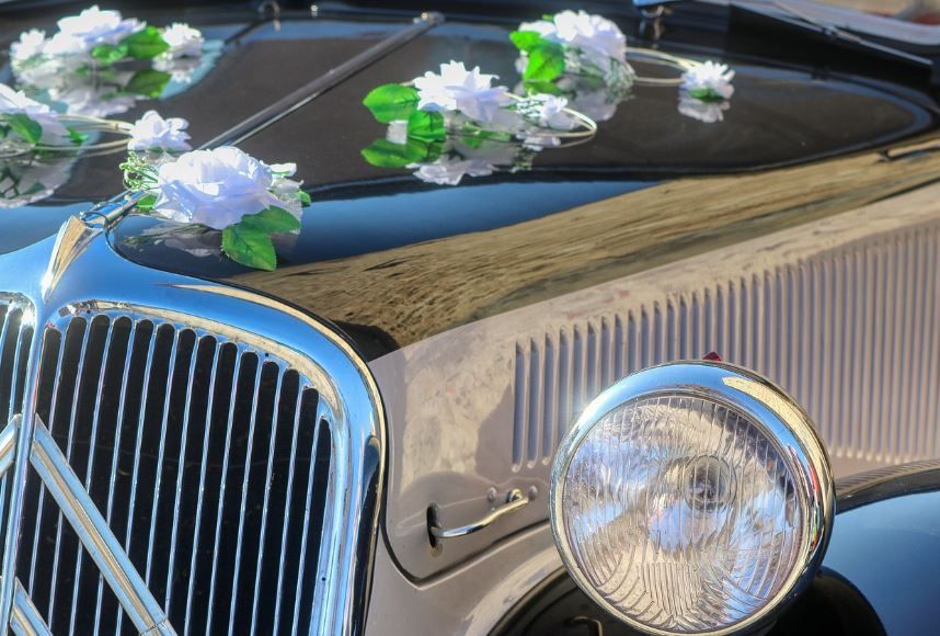White roses arranged on funeral car for seamless ship-in planning, Indianapolis, IN funeral services
