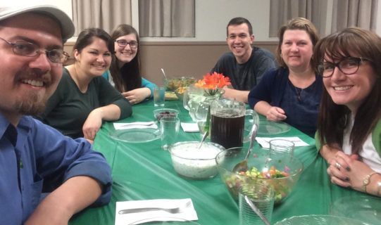 Missions Story Group members around a dinner table