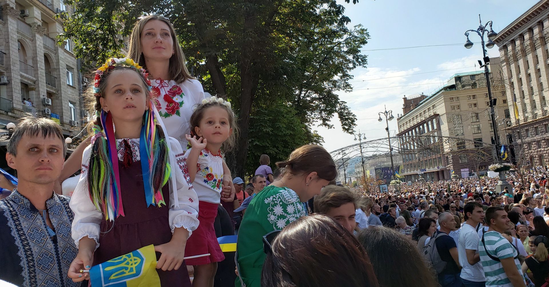 Family looking onward at a festival