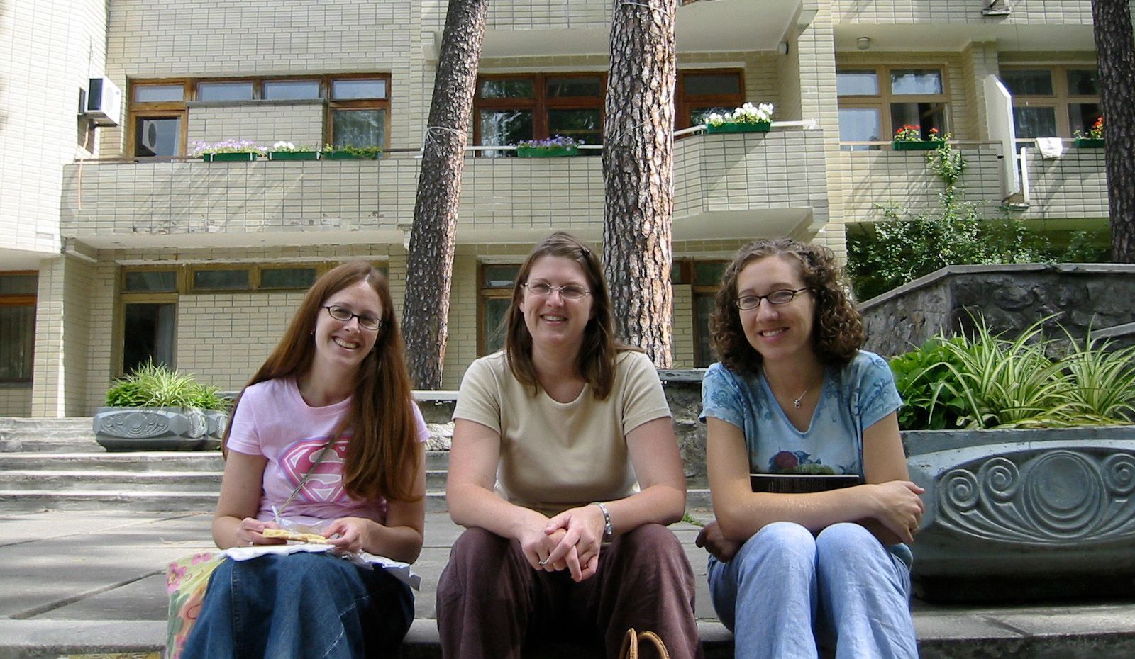 Three friends outside a hotel in Ukraine. 