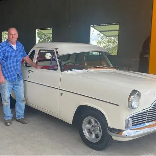Man and a White Vintage Car — Beaudesert, QLD — Beaudesert Tyre Store