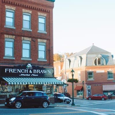 A car is parked in front of french & brawn market place