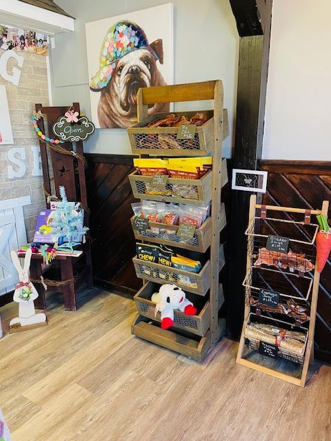 A room with a picture of a dog on the wall.