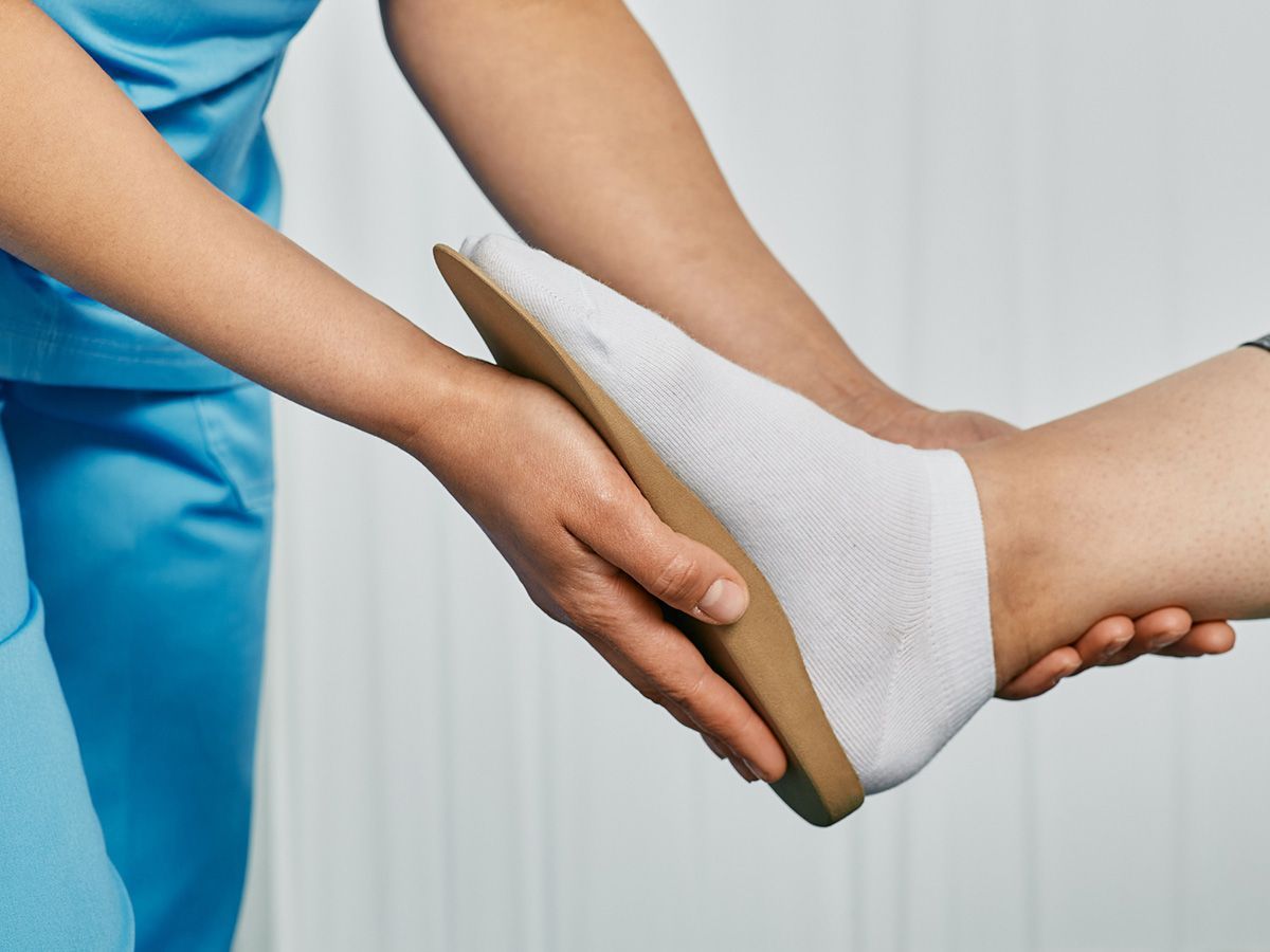 Orthopedist Fitting Individual Orthopedic Insole for Patient Foot — Wichita, KS — Balanced Arches
