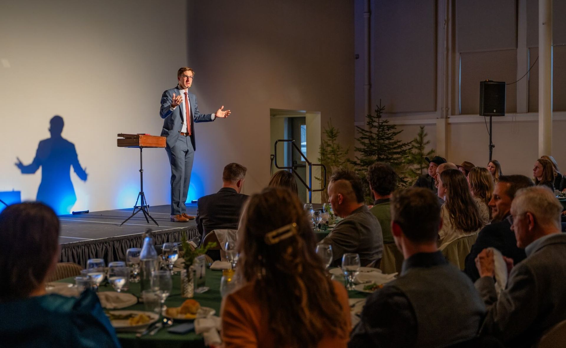 A corporate event planner managing a high-pressure situation with professional entertainment.