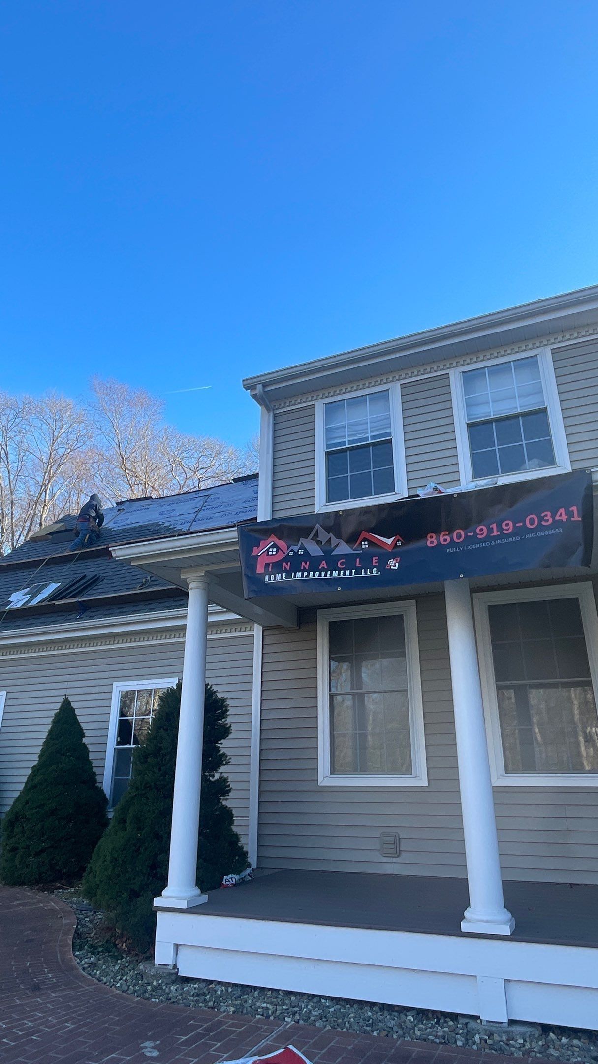 A house with a sign on the porch that says `` ghost pizza ''.