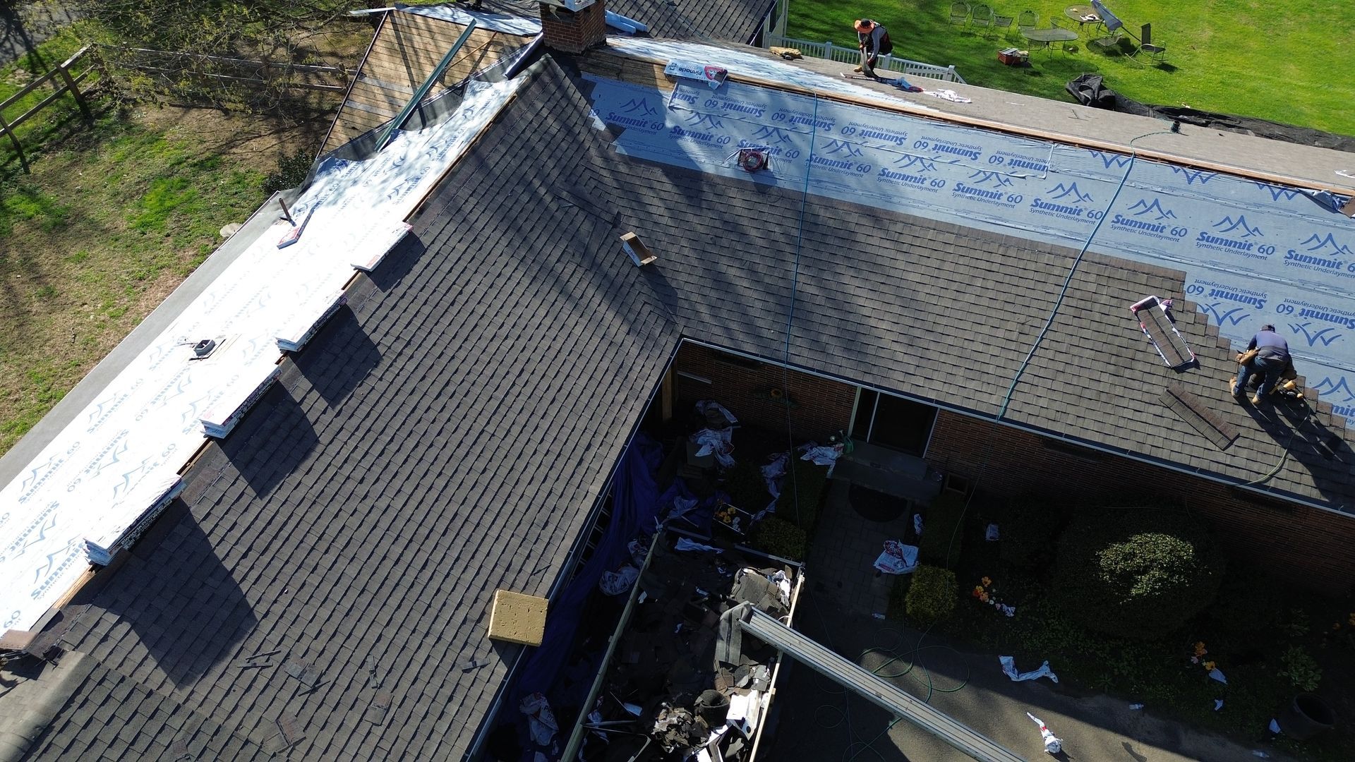 An aerial view of a roof being installed on a house.