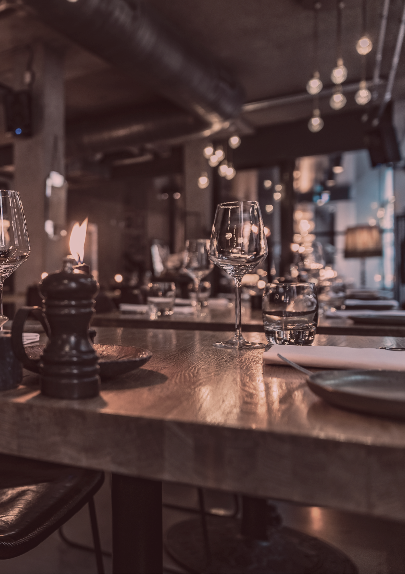 A restaurant table with plates and glasses on it