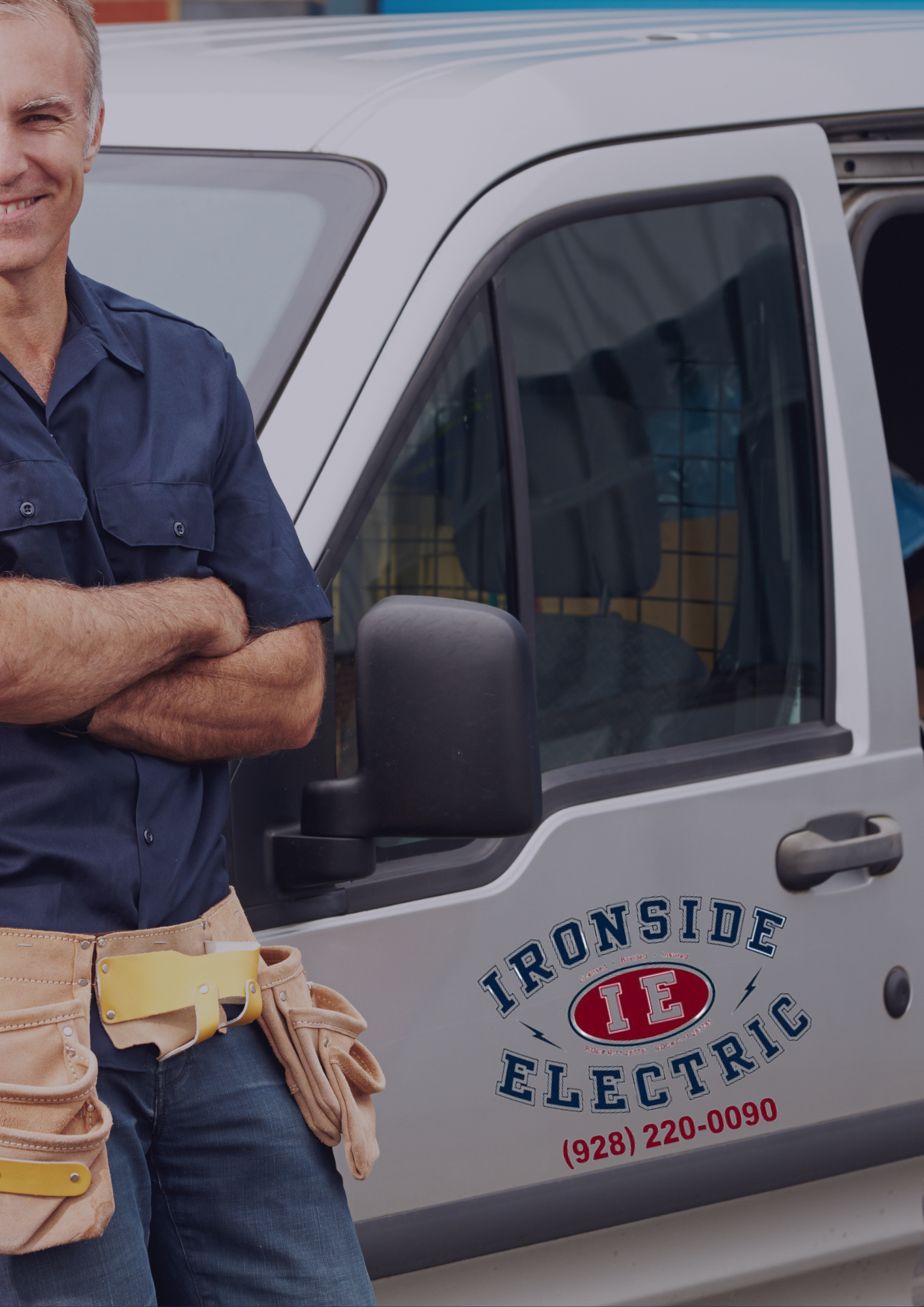 A man standing in front of an ironside electric van