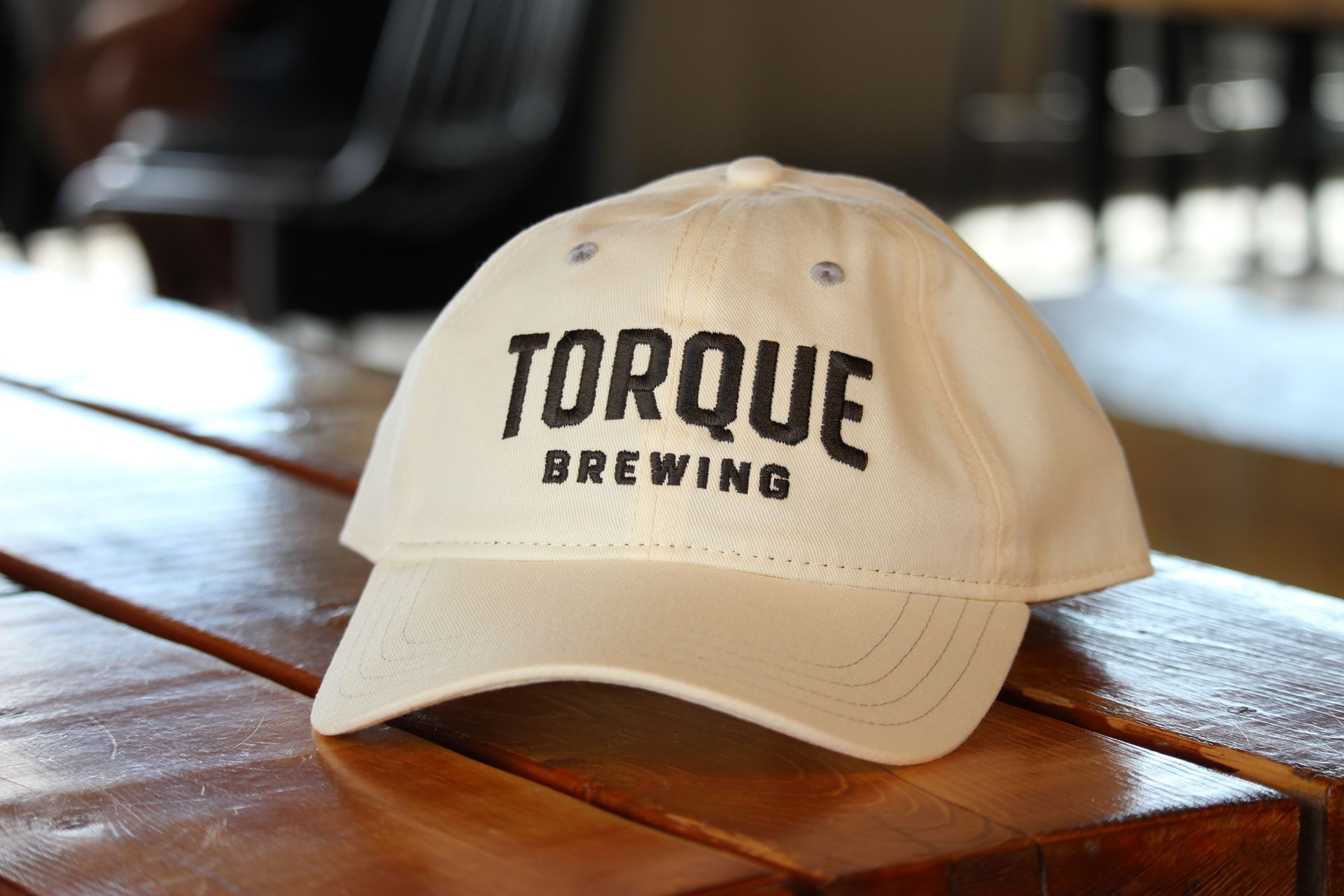 A person wearing a hoodie that says torque brewing