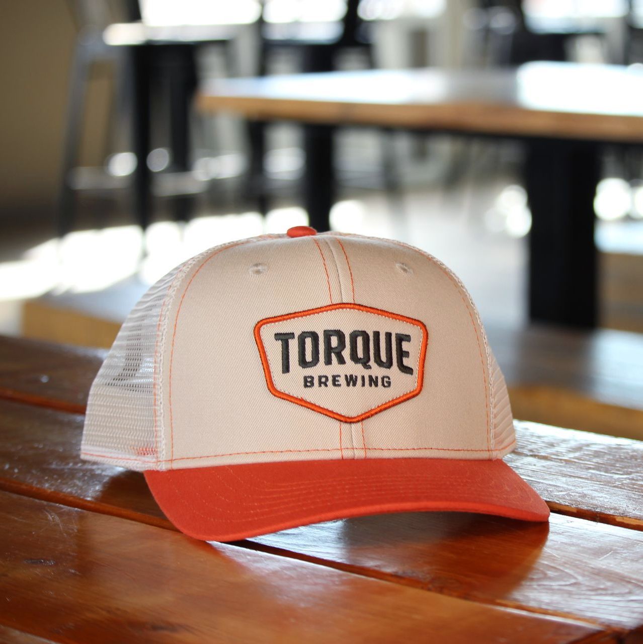 A person wearing a hoodie that says torque brewing