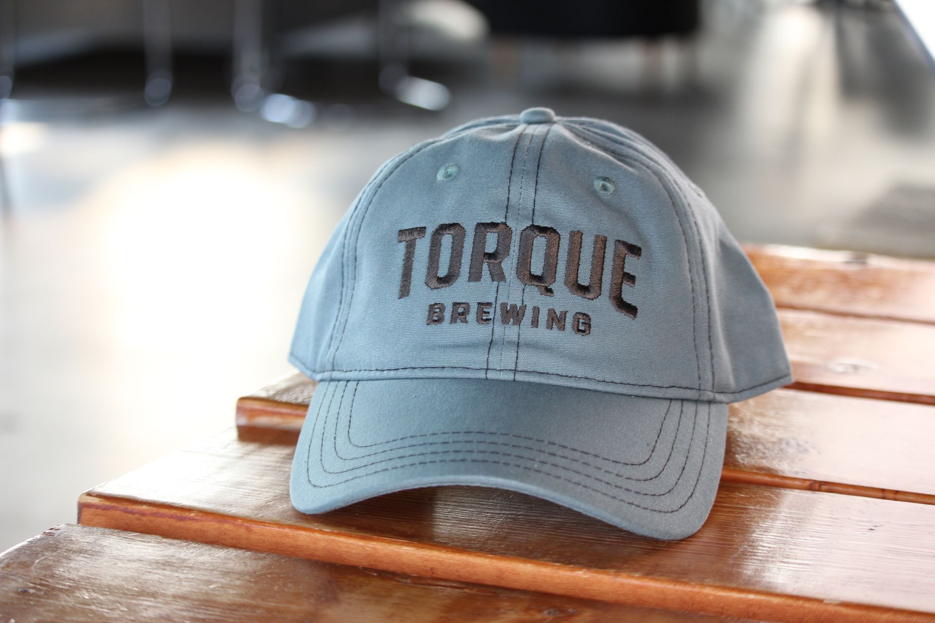 A person wearing a hoodie that says torque brewing