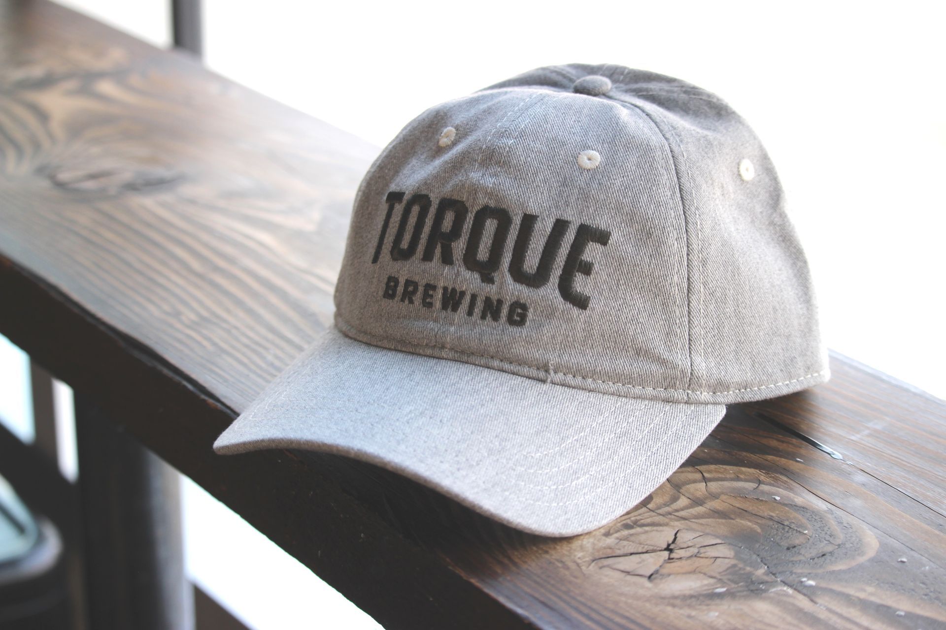 A person wearing a hoodie that says torque brewing