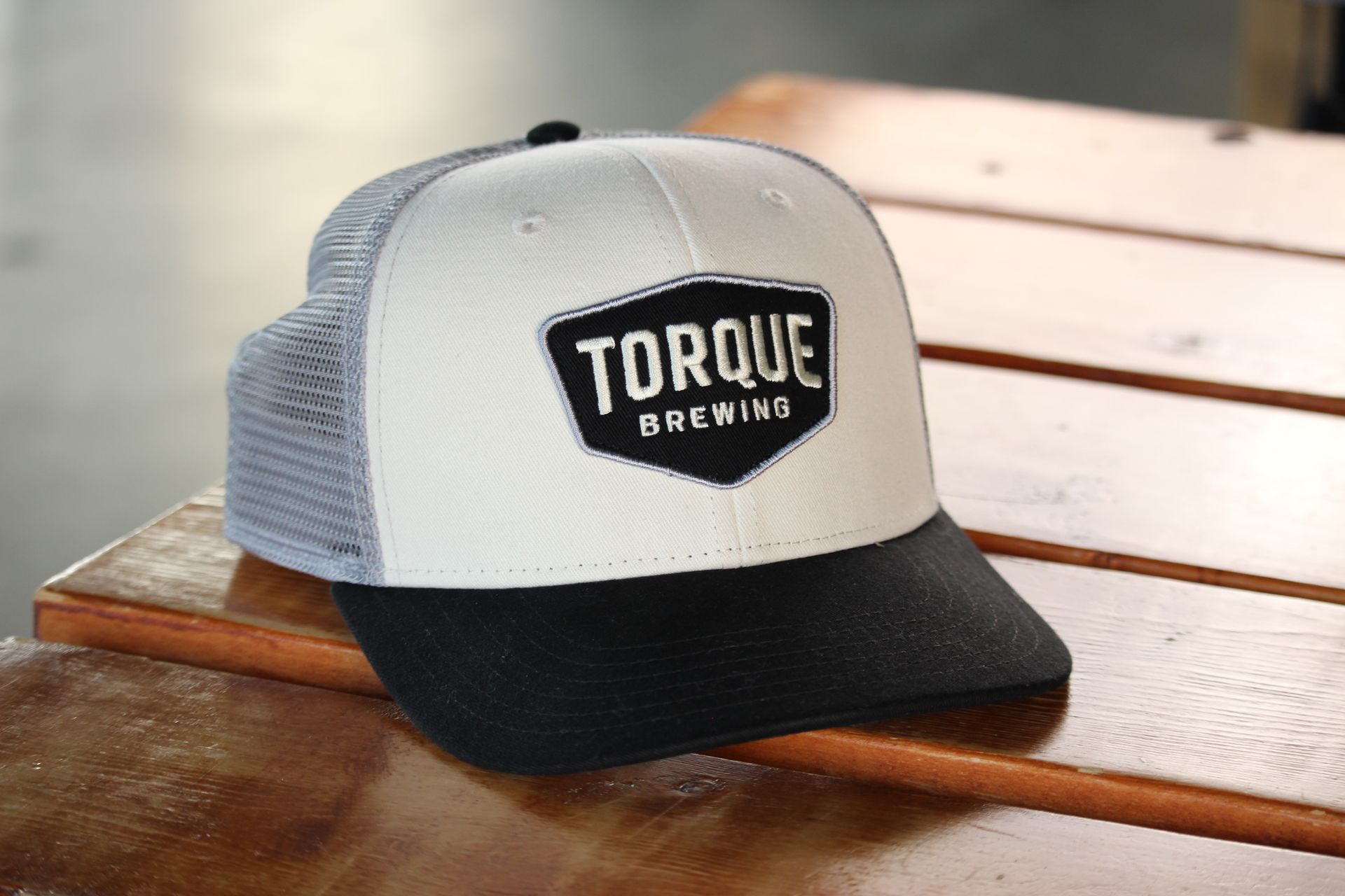 A person wearing a hoodie that says torque brewing