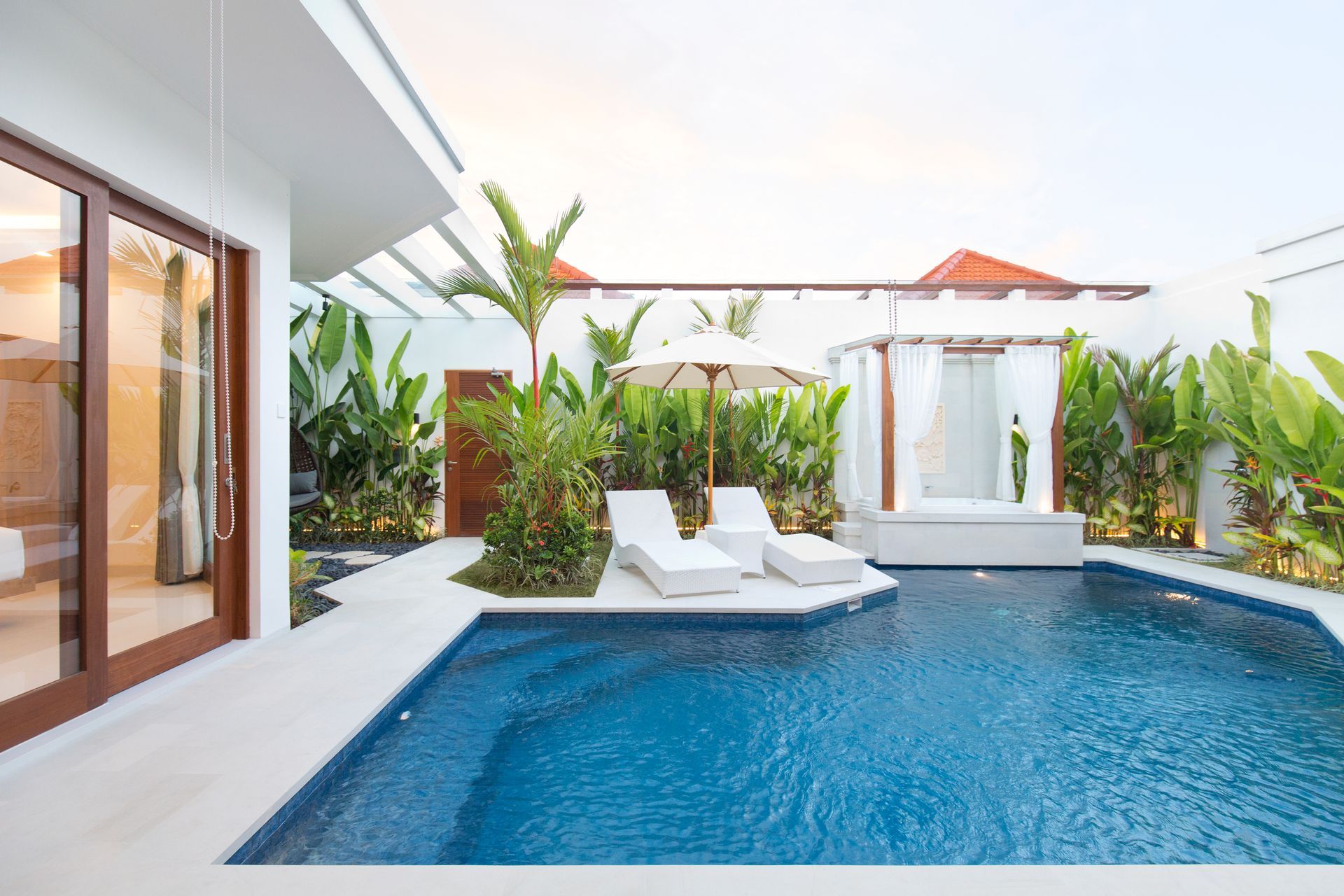 Large pool, living room and jacuzzi at Villa Tirta