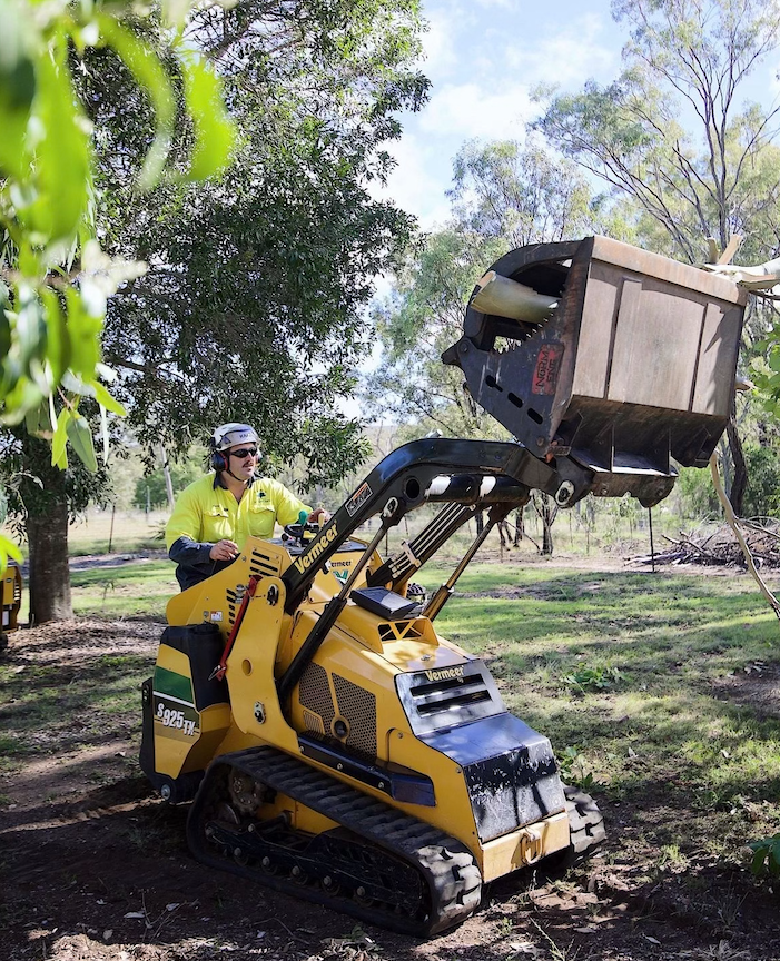 Man Cuts Tree with Chainsaw — Arborist in Chinchilla, QLD