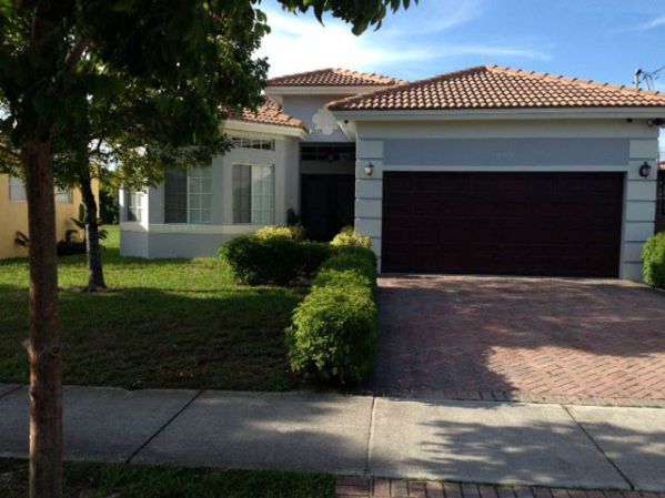 A Best Painting Contractors Wood-Grained-Garage-Door — Residential Painting Services in West Park, FL