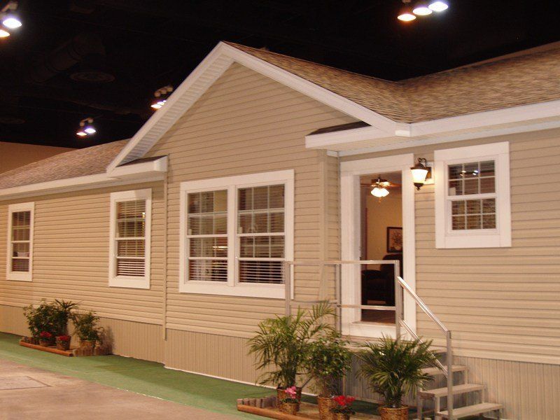 A house with stairs leading up to the front door