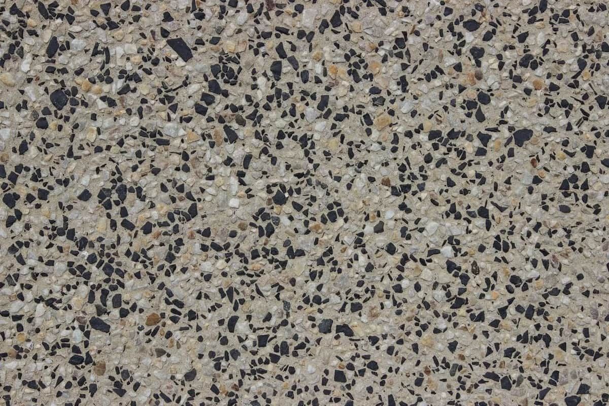 A Close up Of a Concrete Surface with A Lot of Small Rocks on It — Easy Mix Concrete in Berkeley Vale, NSW