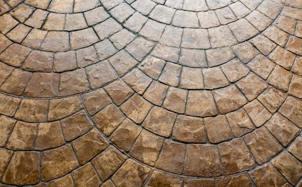 Cobblestone Floor with A Circular Pattern — Easy Mix Concrete in Berkeley Vale, NSW