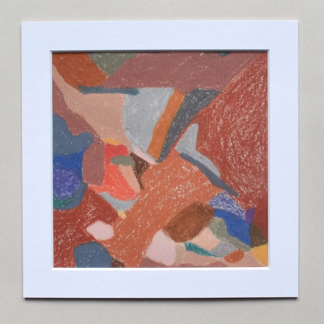 Colourful red and orange abstract drawing with white border on grey background