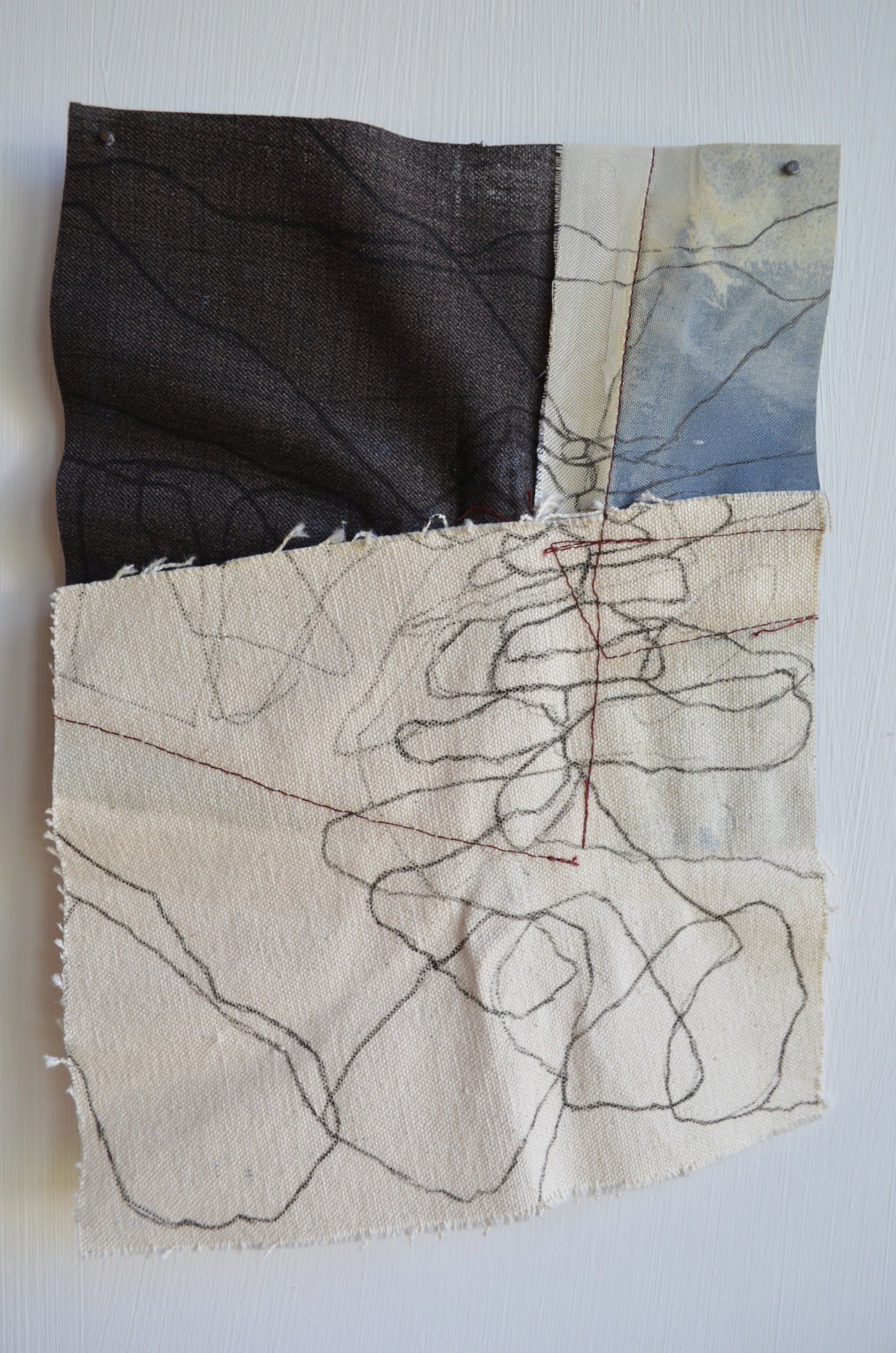 artwork with black line drawing on sewn materials by siobhan mclaughlin
