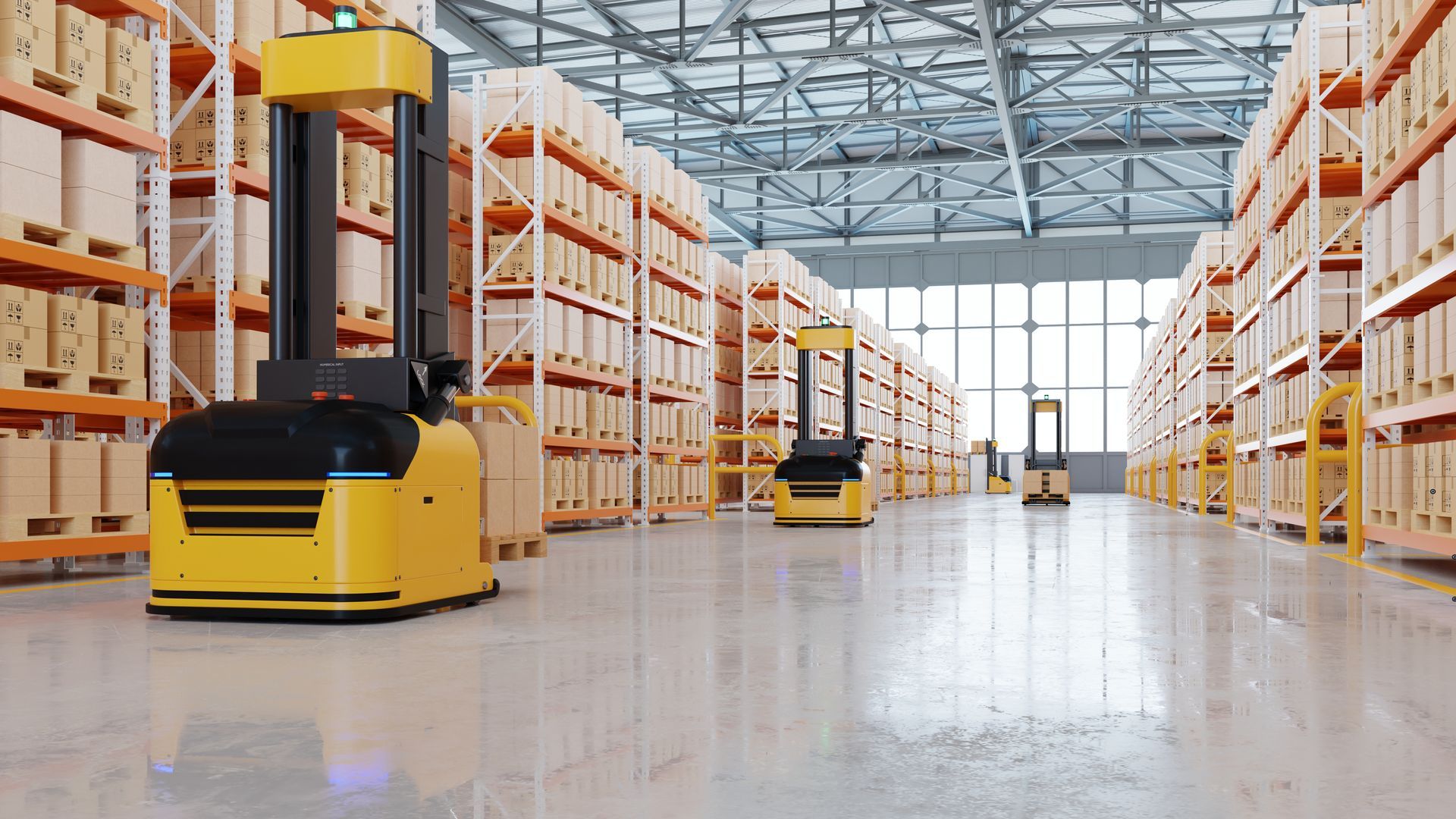 Warehouse interior with yellow automated guided vehicles moving between shelves of boxes.