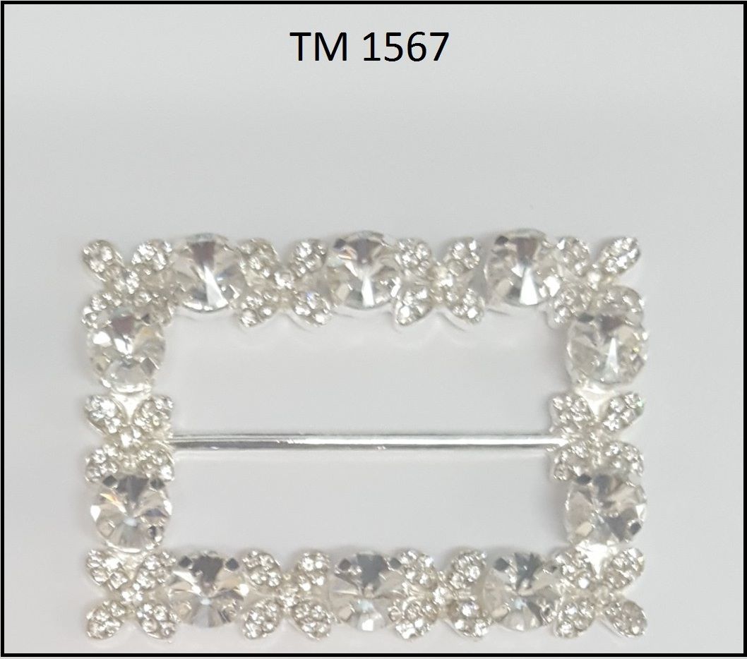 A silver square buckle with rhinestones on it