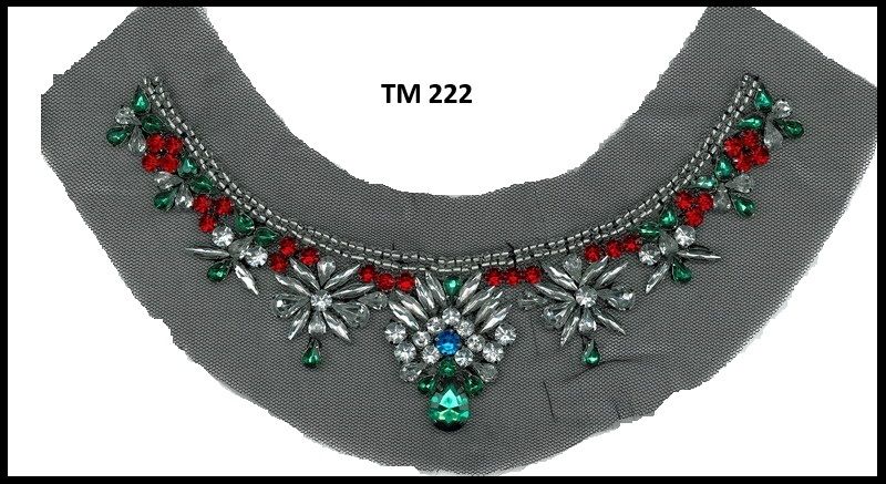 A picture of a necklace with the letters tm 222 on it
