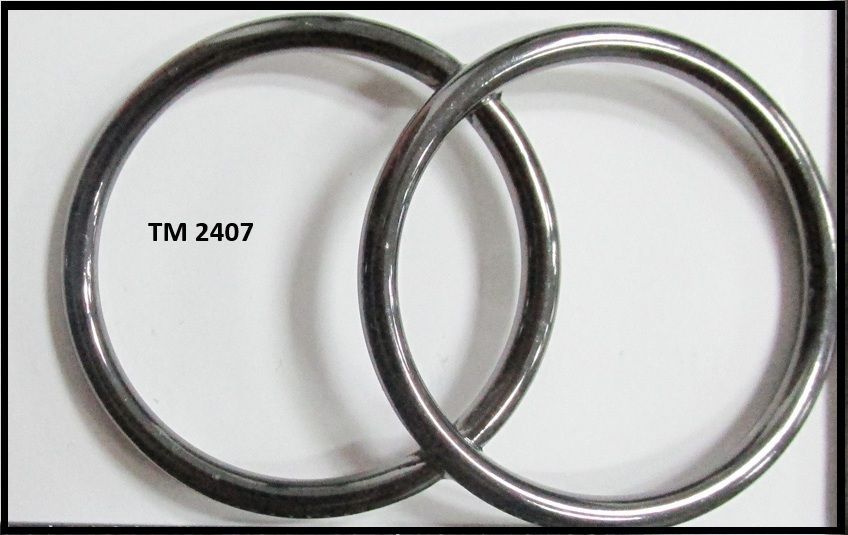Two metal rings with tm 2407 written on the bottom