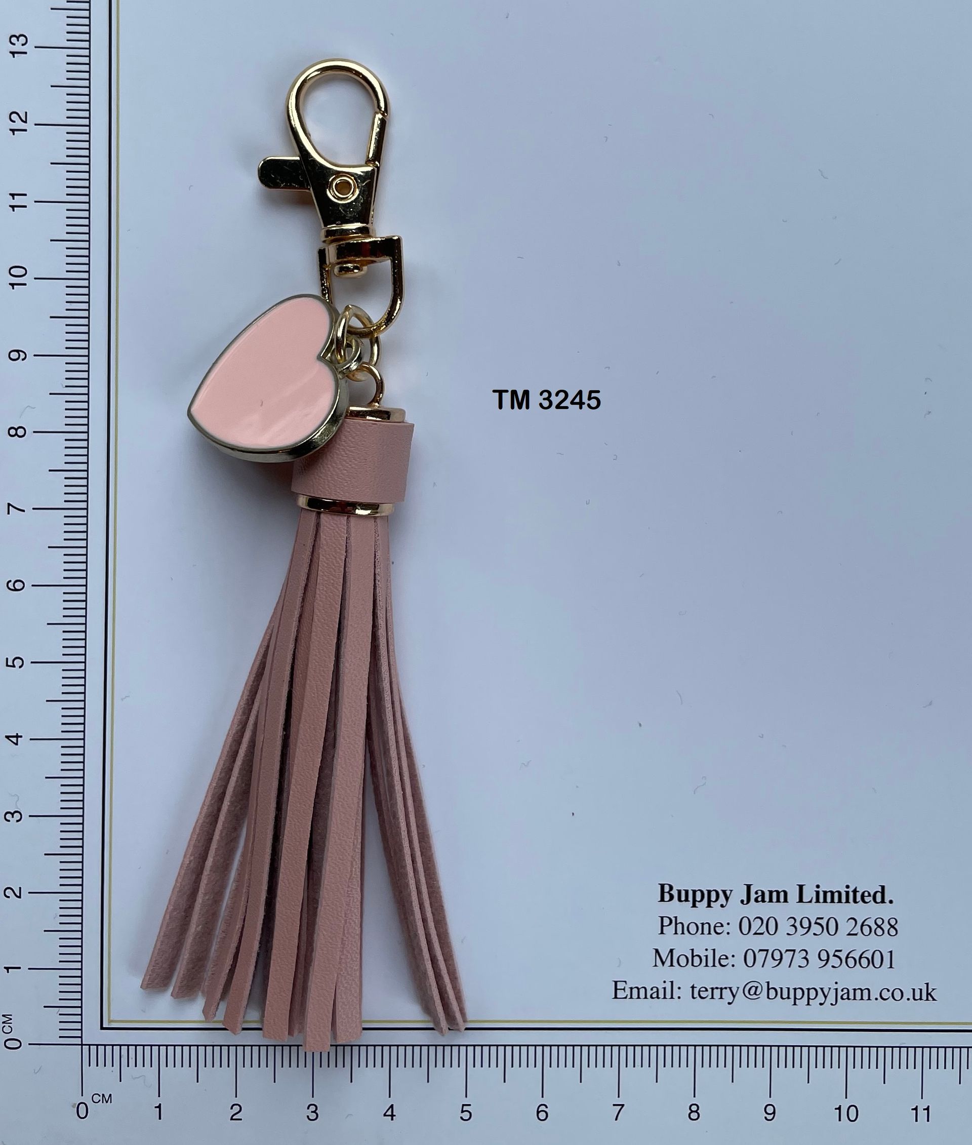 A keychain with a tassel and a heart on it