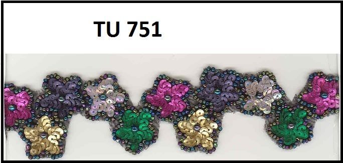 A picture of a sequined ribbon with flowers on it.