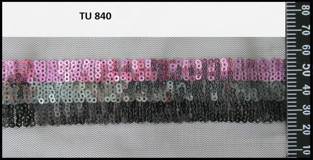 A ruler is being used to measure a piece of fabric